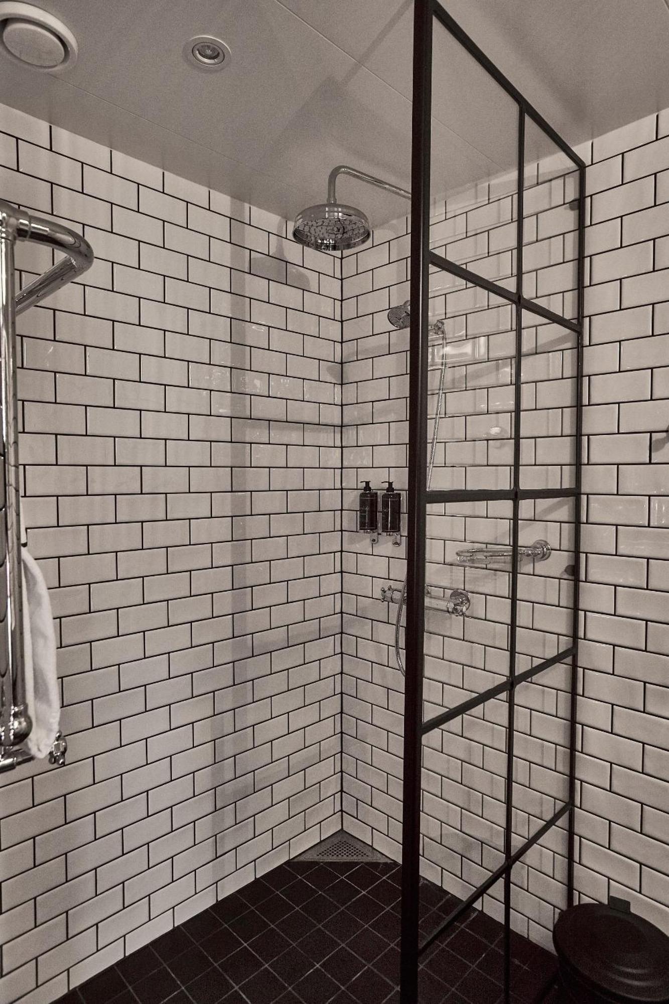 Steam Hotel Västerås Extérieur photo Subway tiles in a shower